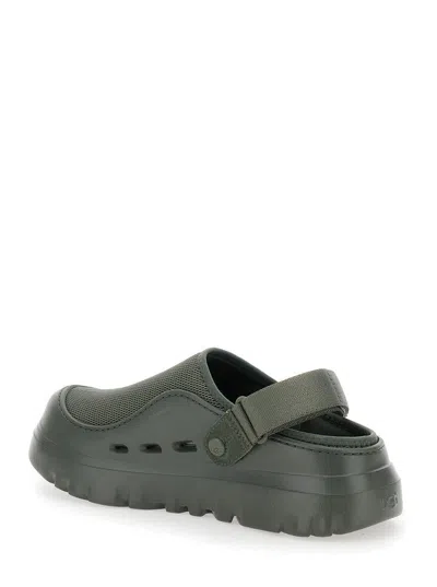 UGG 'PEAKMOD' GREEN MULES WITH ADJUSTABLE STRAP AND LUG SOLE IN TECH FABRIC MAN