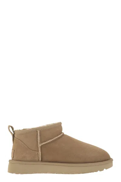 Ugg Sand Suede Classic Ultra Mini Ankle Boots In Beige