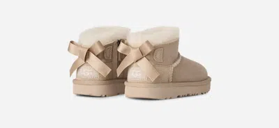 Ugg ® Toddlers' Ultra Mini Bailey Bow Sheepskin Classic Boots In Sand In Neutral