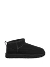 Ugg Classic Ultra Mini Black Ankle Boots With Shearling Lining In Leather Woman In Black