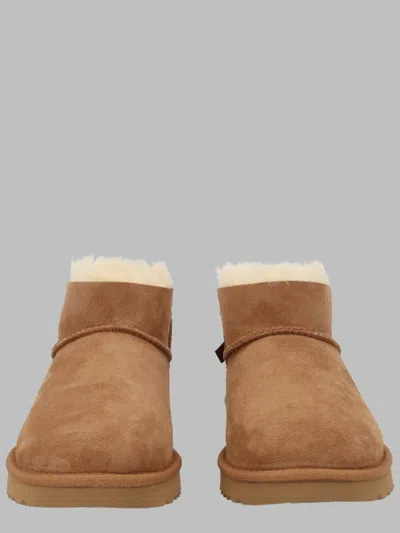 Ugg Ultra Mini Bailey Bow Ankle Boots In Brown