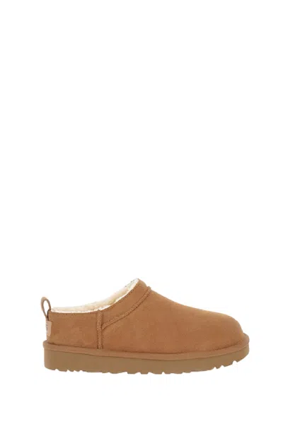 Ugg Water-repellent Suede Slip-on Shoes With Sheepskin Lining In Brown