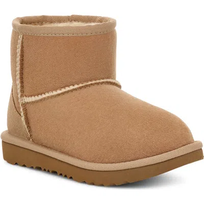 Ugg (r) Kids' Classic Mini Ii Water Resistant Genuine Shearling Boot In Sand