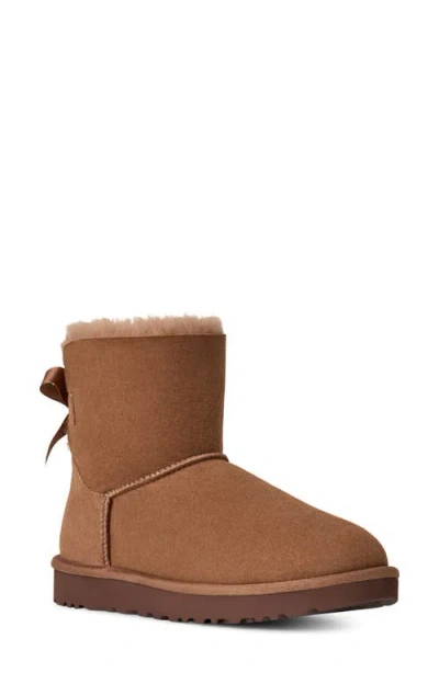 Ugg(r) Mini Bailey Bow Ii Genuine Shearling Bootie In Brown