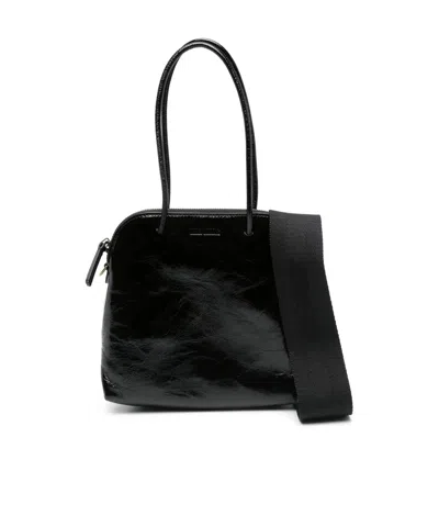 Uma Wang Logo Embossed Zipped Tote Bag In Black