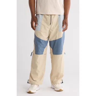 Umbro Zip Off Loose Fit Pants In Pelican/blue