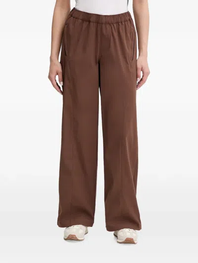 Under Armour Unstoppable Woven Elasticated-waistband Logo-patch Track Pants In Brown