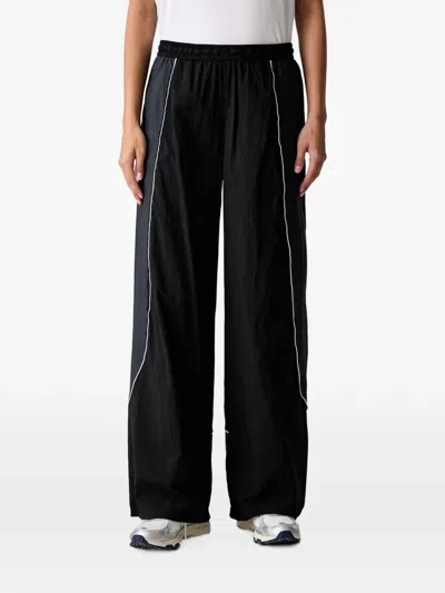 Under Armour Unstoppable Woven Wind Piped Drawstring-hem Track Pants In Black