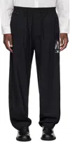Undercover Trousers Graphic Print Elastic Waistband In Black