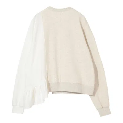 Undercover Cut And Sew Flounces Pullover In Neutral