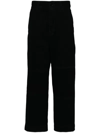UNDERCOVER DISTRESSED-EFFECT TROUSERS