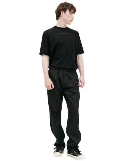 Undercover Embroidered Logo Trousers In Black