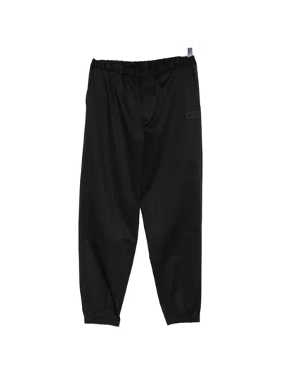 Undercover Logo Embroidered Trousers In Black