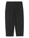 Undercover Pleated Tapered Trousers In Black