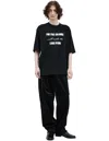 Undercover Graphic Print Black T-shirt With Exposed-seam Detailing And Logo Patch
