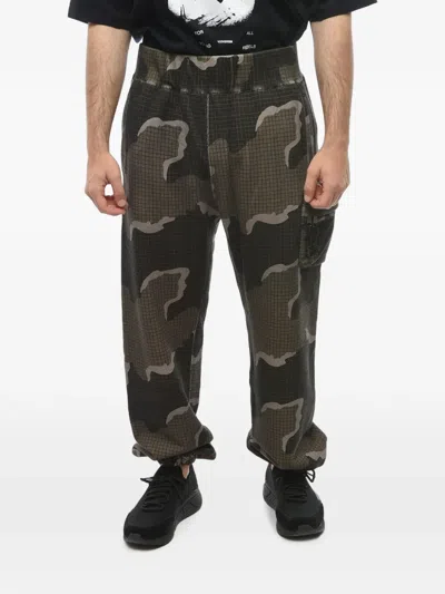 Undercover X Eastpak Camouflage-print Cotton Track Pants In Green