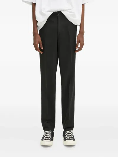 Undercover Zip-pocket Trousers In Black