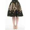Unique Vintage Printed Woven Gellar Swing Skirt In Black Gold Feathers