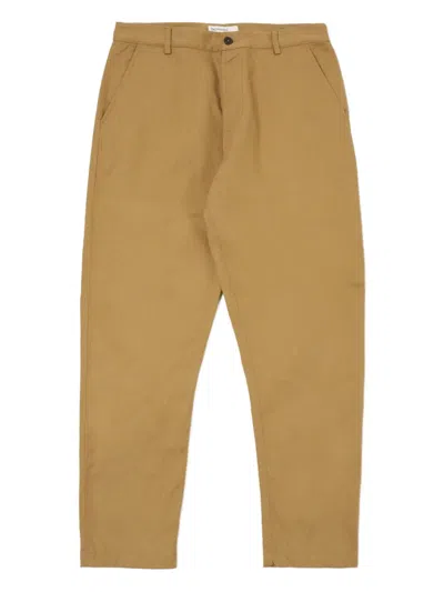 Universal Works Chino Trousers In Brown