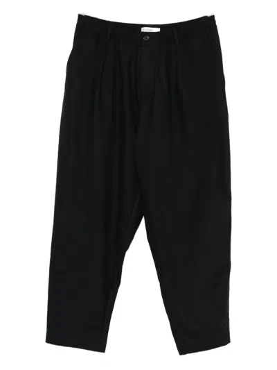 Universal Works Pleated-front Tapered Trousers In Blue