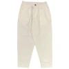 UNIVERSAL WORKS PLEATED TRACK PANT IN ECRU