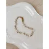 Untamed Petals Opulent Pearl And Crystal Bracelet In Gold