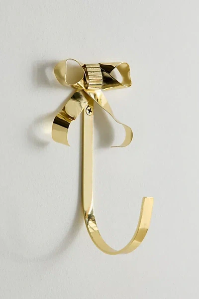 Urban Outfitters Marina Bow Shape Metal Wall Hook In Brass At  In Gold