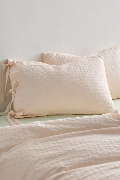 Urban Outfitters Seersucker Tied Trim Cotton Sham Set In Peach Dust At  In Nude