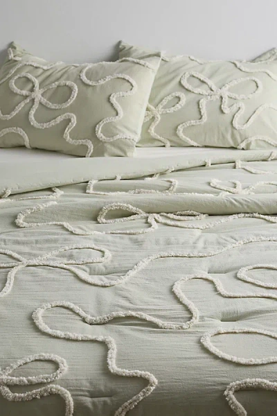 URBAN OUTFITTERS WILD BOWS TUFTED COMFORTER IN SAGE AT URBAN OUTFITTERS