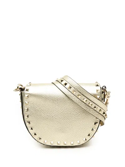 Pre-owned Valentino Garavani 2018-2026 Metallic Grained Calfskin Rockstud Saddle Crossbody Bag In Gold