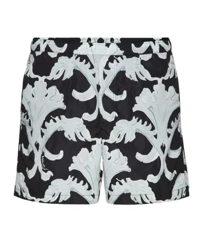 VALENTINO VALENTINO	ALL-OVER PRINTED MID-RISE SWIM SHORTS