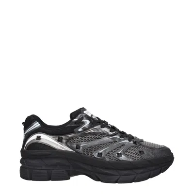 Valentino Garavani Leather Sneakers With Textured Rubber Elements In Black