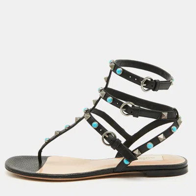Pre-owned Valentino Garavani Black Leather Rolling Rockstud Ankle Strap Flat Sandals Size 38.5