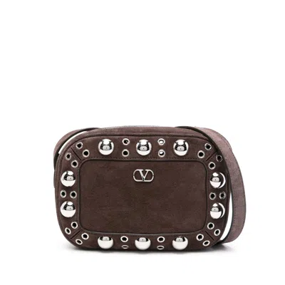 Valentino Garavani Dome-shaped Crossbody Bag With Metallic Eyelets And Adjustable Strap In Brown