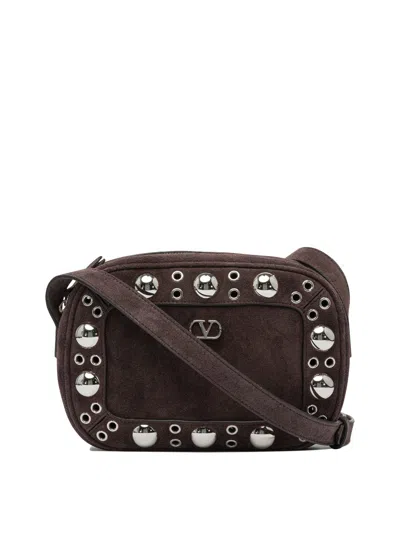 Valentino Garavani Dome-shaped Crossbody Bag With Metallic Eyelets And Adjustable Strap In Brown