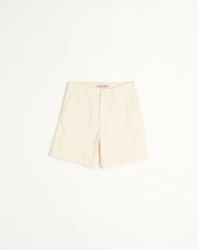Valentino Cuffed Denim Bermuda Shorts In Ecru