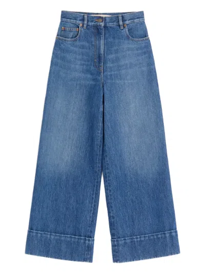 Valentino Cuffed V-motif Cropped Jeans In Blue