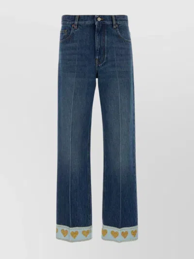 VALENTINO DENIM JEANS WITH HEART PATTERN HEM