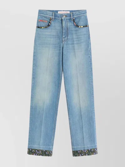 VALENTINO DENIM TROUSERS WITH FLORAL TRIM