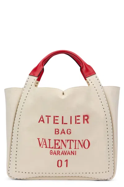 VALENTINO GARAVANI ELEGANT LIGHT BAG WITH RED HANDLES
