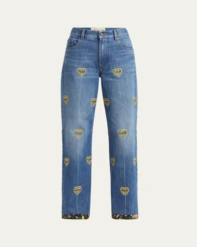 VALENTINO EMBROIDERED HEART DENIM PANTS WITH FLORAL BOARDER