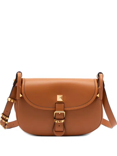 Valentino Garavani Flaneuse Studded Buckle-strap Leather Shoulder Bag In Brown