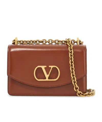 Valentino Garavani Vain Glossed-leather Shoulder Bag In Brown