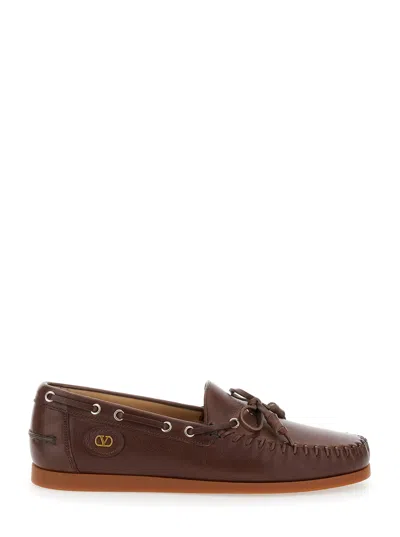 Valentino Garavani Almond Toe Leather Tassel Loafers With Vlogo Patch In Brown