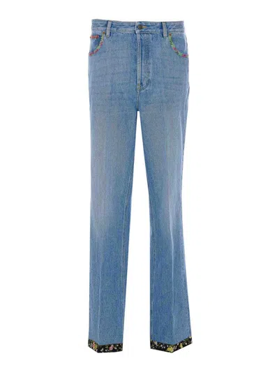 Valentino Garavani Floral Print Hem Denim Trousers In Blue