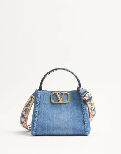 VALENTINO GARAVANI VALENTINO GARAVANI GARAVANI ALLTIME MEDIUM HANDBAG IN DENIM WITH EMBROIDERED STRAP WOMAN DENIM/WORKE