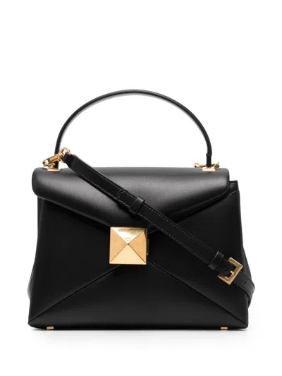 Valentino Garavani Handbags. In Black