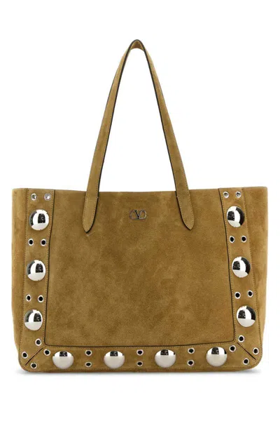 Valentino Garavani Handbags. In Beige O Tan