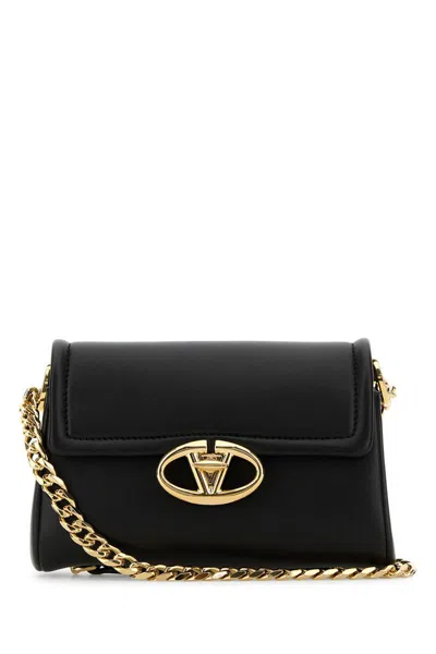 Valentino Garavani Handbags. In Black