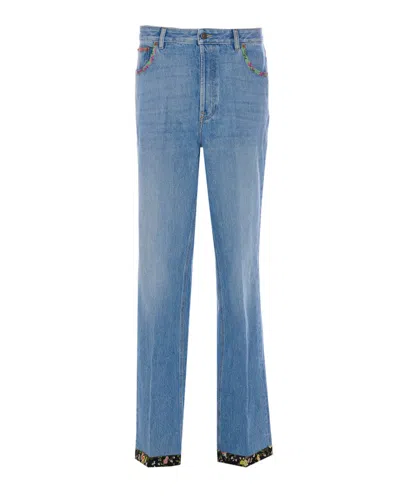 Valentino Garavani Floral Print Hem Denim Trousers In Blue